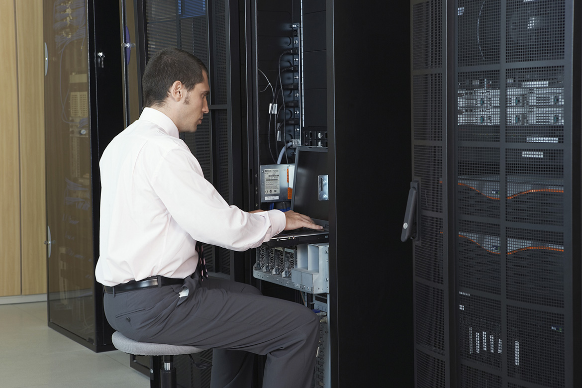 Technician Working in Server Room